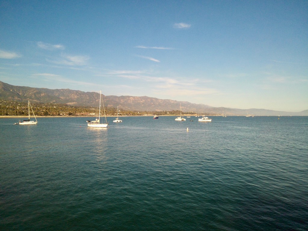 Photo of boats in the Pacific Ocean taken from the wharf in Santa Barbara.