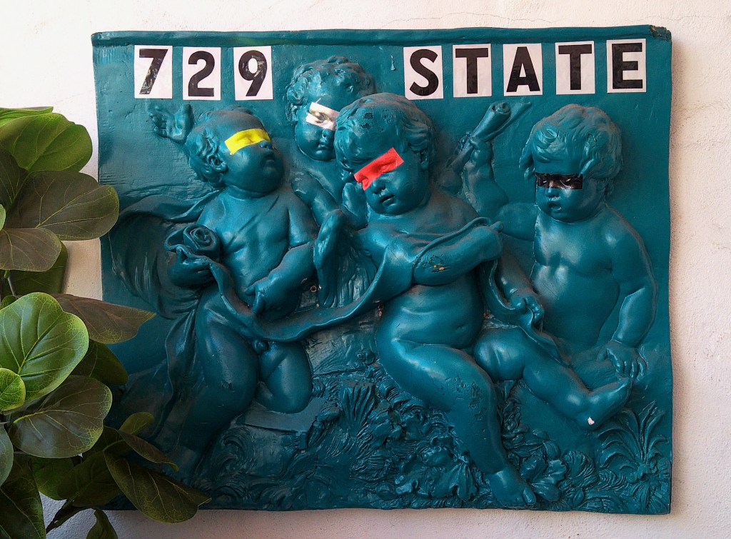 Address sign for a funky vintage shop selling weird and old stuff. 